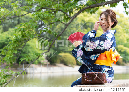A woman with a yukata with a fan A woman with a yukata with a fan 41254561