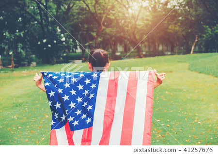 Happy kid little child running with American flag Happy kid little child running with American flag 41257676