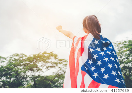Happy kid little child standing with American flag Happy kid little child standing with American flag 41257689