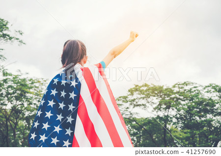 Happy kid little child standing with American flag Happy kid little child standing with American flag 41257690