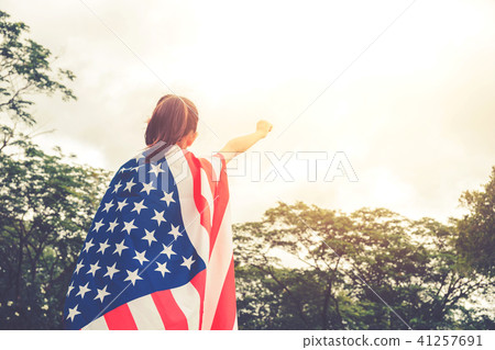Happy kid little child standing with American flag Happy kid little child standing with American flag 41257691
