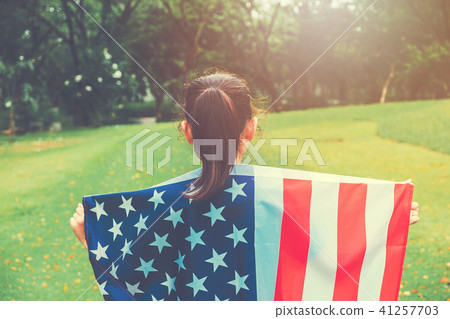Happy kid little child running with American flag Happy kid little child running with American flag 41257703