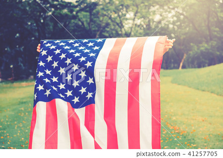 Happy kid little child running with American flag Happy kid little child running with American flag 41257705