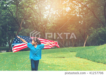 Happy kid little child running with American flag Happy kid little child running with American flag 41257706