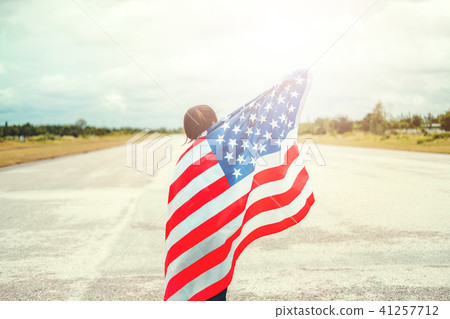 Happy kid little child standing with American flag 41257712