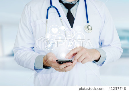 Doctor using smartphone and health care icon Doctor using smartphone and health care icon 41257748