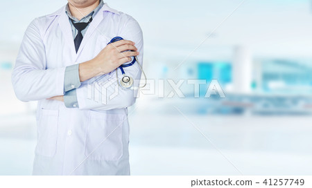 Doctor holding a stethoscope on background  41257749