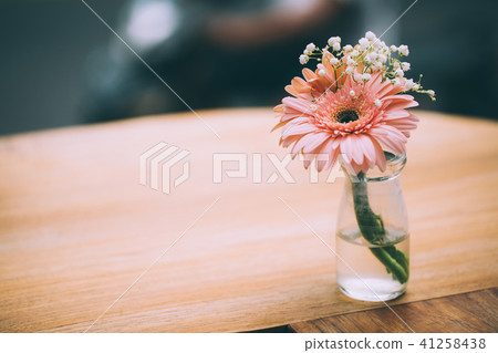 Pink gerbera on wooden table 41258438