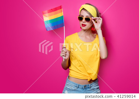 girl holding big LGBT flag 41259014