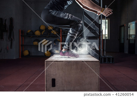 Box jump workout at cross fit gym closeup Box jump workout at cross fit gym closeup 41260054