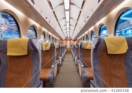 Interior of a train with empty seats.  41260198
