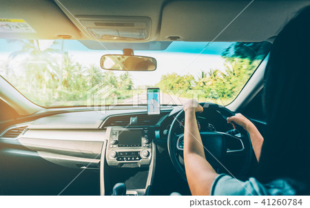 Woman using navigation app on smartphone Woman using navigation app on smartphone 41260784