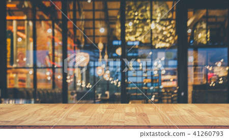 wooden table in front  blurred restaurant  41260793
