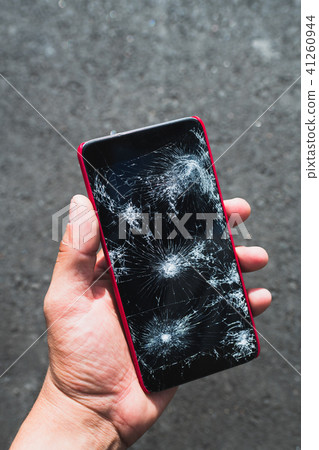 Person holding broken smartphone 41260944