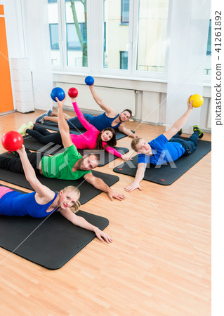 Workout group in gymnasium during physiotherapy  41261892