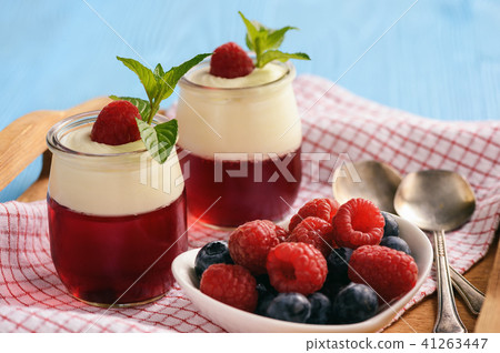 Pannacotta with berry jelly and berries. Pannacotta with berry jelly and berries. 41263447