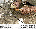 Hands the poor old man's,piece of bread and change 41264358