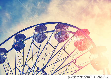 Picture of a Ferris wheel at sunset. 41264367
