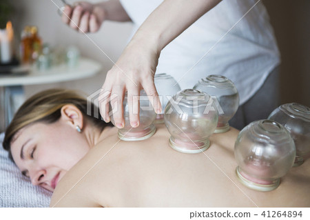 Young woman getting treatment at medical clinic Young woman getting treatment at medical clinic 41264894