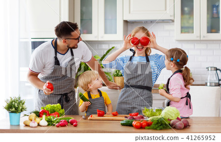 happy family with children preparing vegetable salad . 41265952
