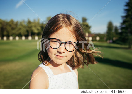 Portrait of smiling girl in glasses. 41266893