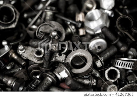 Close-up of used steel bolts background Close-up of used steel bolts background 41267365