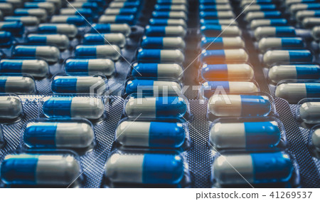 Blue and white capsules pill in blister pack  41269537