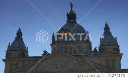 Waving German flag over the Federal Administrative Court building 41274133