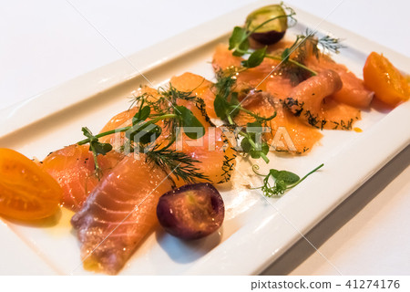 A plate of gravlax, scandinavian cured salmon. A plate of gravlax, scandinavian cured salmon. 41274176