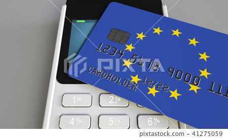 Payment or POS terminal with credit card featuring flag of the European Union. EU retail commerce or Payment or POS terminal with credit card featuring flag of the European Union. EU retail commerce or 41275059