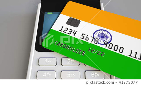 Payment or POS terminal with credit card featuring flag of India. Indian retail commerce or banking Payment or POS terminal with credit card featuring flag of India. Indian retail commerce or banking 41275077