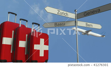 Travel baggage featuring flag of Switzerland, airplane and city sign post. Swiss tourism conceptual 41276301