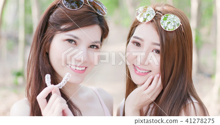 two beauty women smile happily two beauty women smile happily 41278275