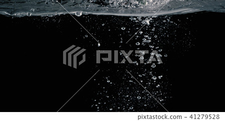 Soda water splashing drop in black background 41279528