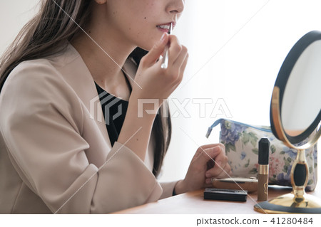 Young business woman painting lipstick 20's Japanese woman Young business woman painting lipstick 20's Japanese woman 41280484