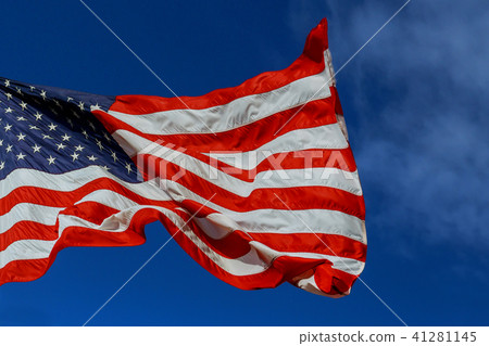 The American flag waving in blue sky 41281145