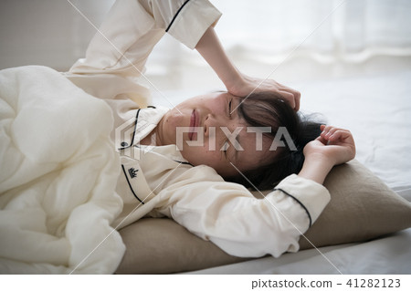 A young Japanese woman lacking sleep A young Japanese woman lacking sleep 41282123