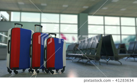 Travel suitcases featuring flag of Russia. Russian tourism conceptual 3D rendering Travel suitcases featuring flag of Russia. Russian tourism conceptual 3D rendering 41283634