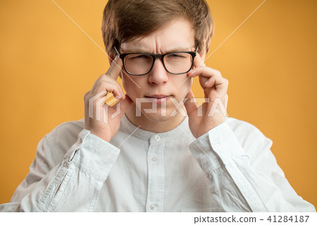 close up portrait of student with bad memory. try to memorise facts,datas. 41284187