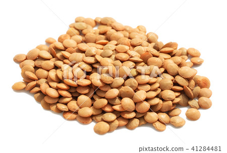 Heap of dry lentils isolated on white 41284481