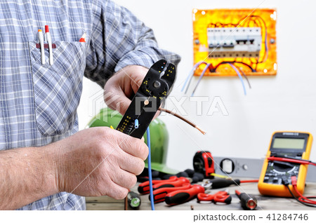 Electrician at work on an electrical system 41284746
