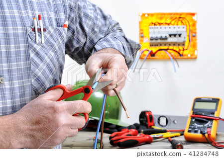 Electrician at work on an electrical system 41284748