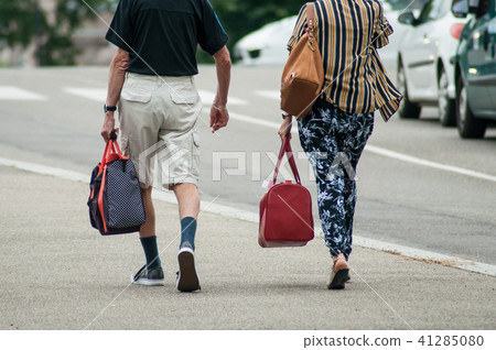 couple walking with bag near train station couple walking with bag near train station 41285080