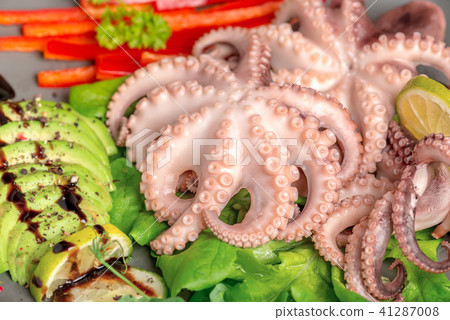 close up of octopus served with sliced avocado close up of octopus served with sliced avocado 41287008