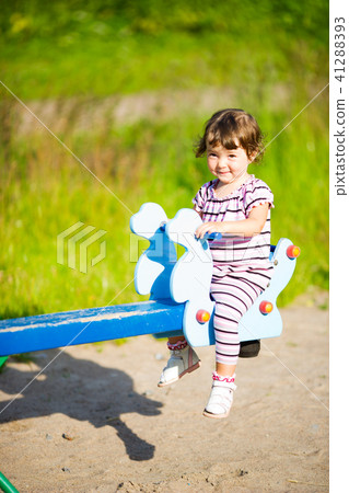 Girl on swings Girl on swings 41288393