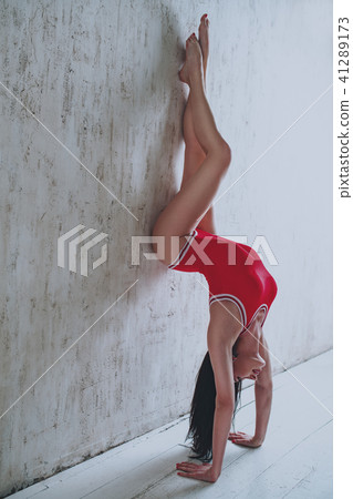 Woman standing on hands Woman standing on hands 41289173