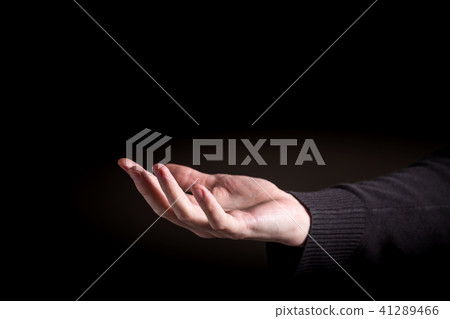 Man holding his hand and showing something 41289466