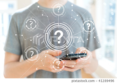 Question Marks with man using a smartphone Question Marks with man using a smartphone 41289496
