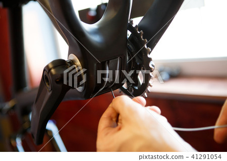 Photo of man repairing bicycle gear Photo of man repairing bicycle gear 41291054