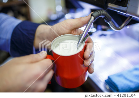 Image of man with glass with milk and spoon Image of man with glass with milk and spoon 41291104